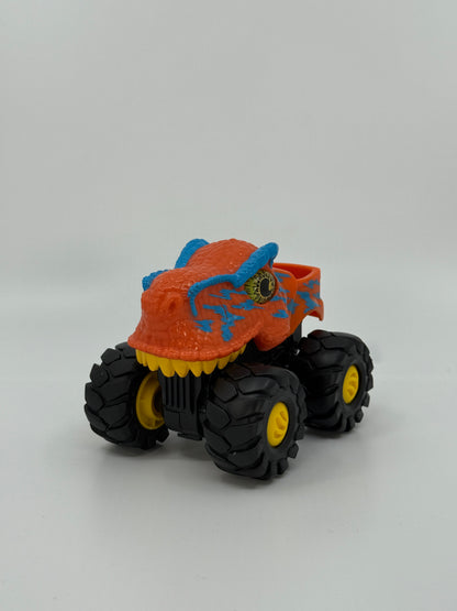 Oranž dinosauruseliku välimusega monsterauto