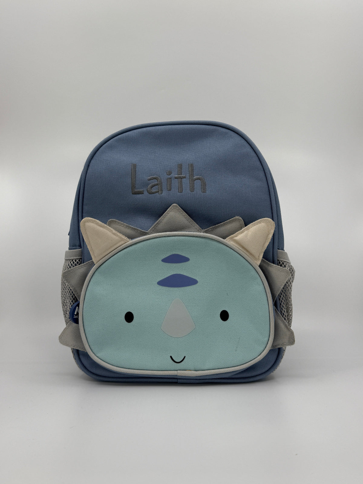 Sinine laste seljakott dinosaurusega