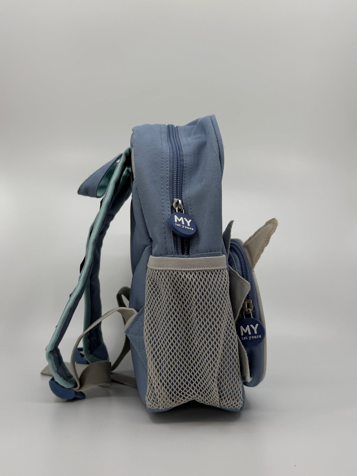 Sinine laste seljakott dinosaurusega