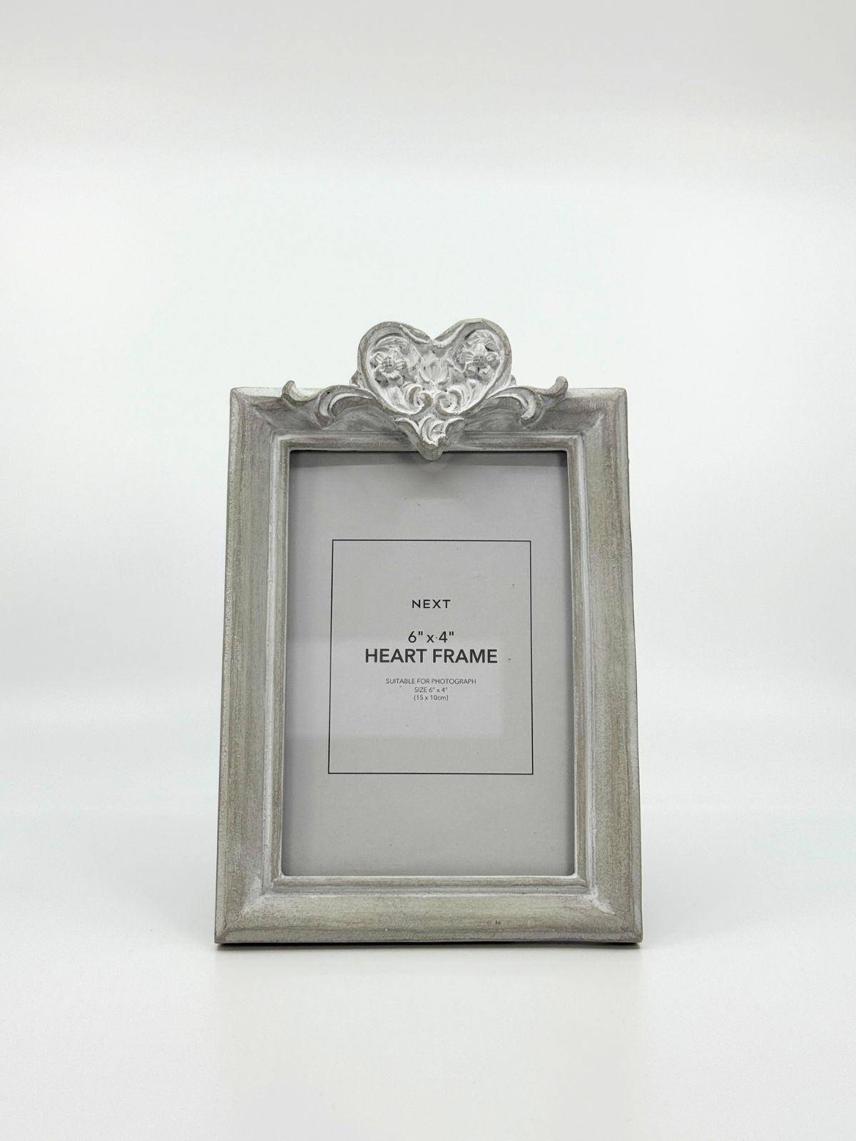 Hallikas fotoraam südame detailiga