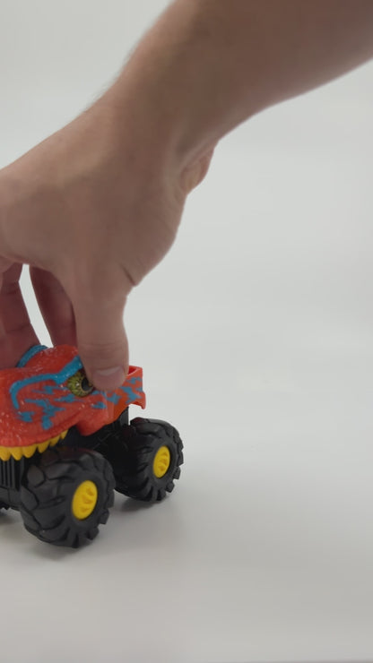 Oranž dinosauruseliku välimusega monsterauto